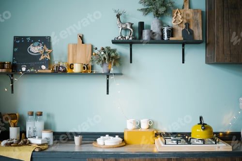 Preview: Festively Decorated Wooden Kitchen with Blue Walls in Scandinavian Style