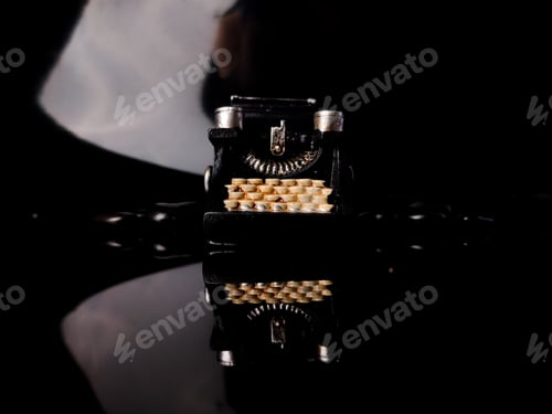 Preview: Black vintage typewritter with reflection