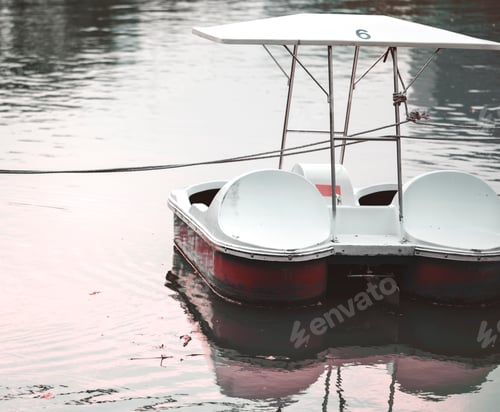 Preview: Paddle boat in a dark lake