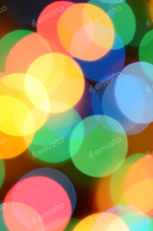 Preview: Blurred festive colorful lights over black useful as background. All main colors included