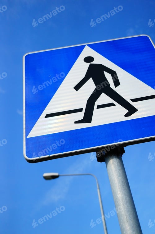 Preview: Low angle shot of a blue zebra crossing traffic sign