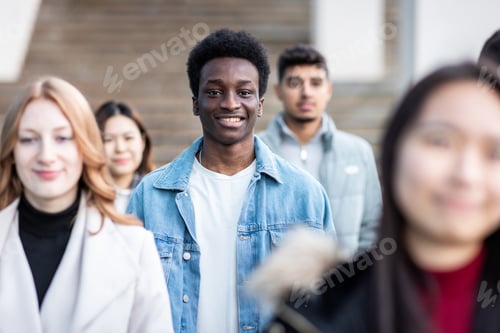 Preview: Multiracial crowd of people in the city commuting and walking on pavement