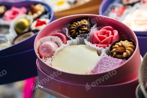 Preview: Beautiful delicious pastries on a showcase in a shop