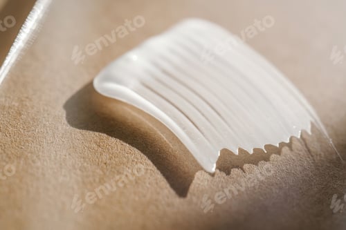 Preview: White cream texture on a beige background.