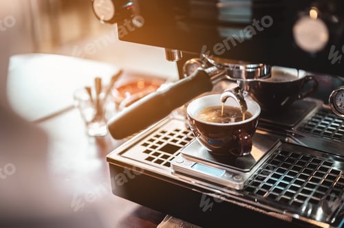 Preview: Close-up coffee maker that is professionally extracting coffee by barista