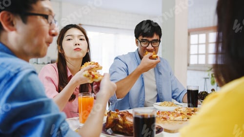 Preview: Happy young friends group having lunch at home.