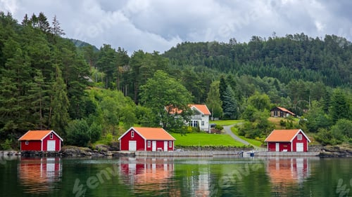 Preview: Charming Red Cabins by Tranquil Norwegian Fjord With Lush Greenery
