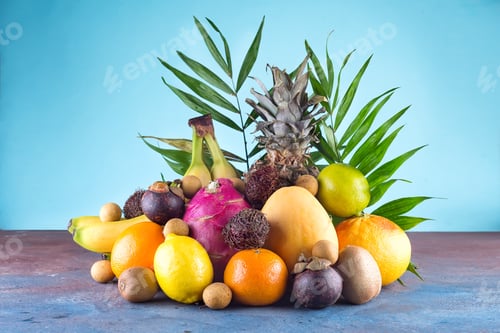 Preview: Assorted tropical fruits, orange,Ananas or pineapple, lime,mango, dragon fruit, orange, banan
