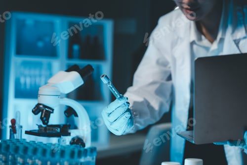 Preview: biochemical research scientist working with microscope for coronavirus vaccine development in, Portr