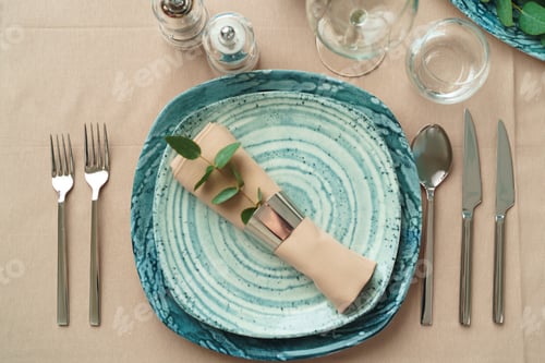 Preview: Beautiful elegant table setting with green stylish dishware and silver cutlery