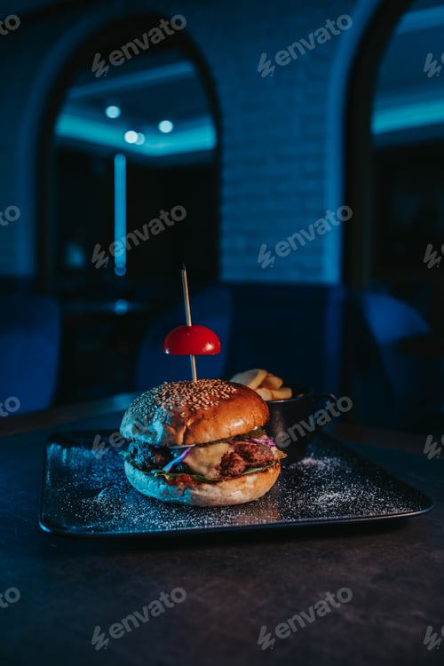 Preview: Selective focus shot of a tasty hamburger with french fries in a bowl