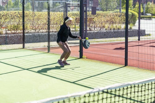 Preview: Young girls playing padel on a sunny day
