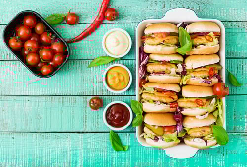 Preview: Mini hamburgers with chicken burger, cheese and a vegetables. Flat lay. Top view.