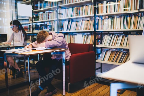 Preview: Exhausted worker lying face down on table