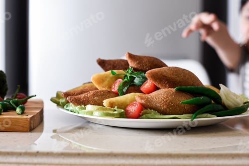 Preview: Kibbeh is a family of dishes based on spiced ground meat, onions, and grain, popular in Middle Easte