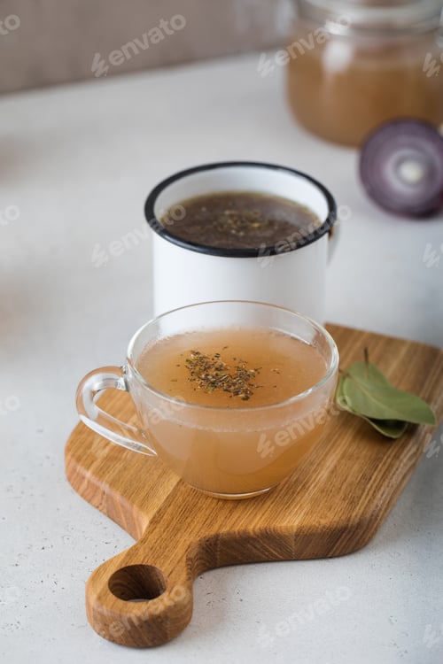 Preview: Healthy homemade bone broth. The concept of keto diet and healthy eating.