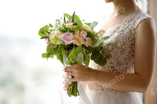 Preview: Bride holding stylish wedding flowers. Elegance rustic style pastel colors bouquet in woman hands