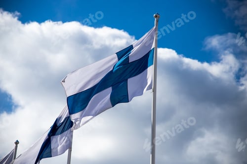 Preview: Beautiful shot of flags of Finland waving with a background of a cloudy sky