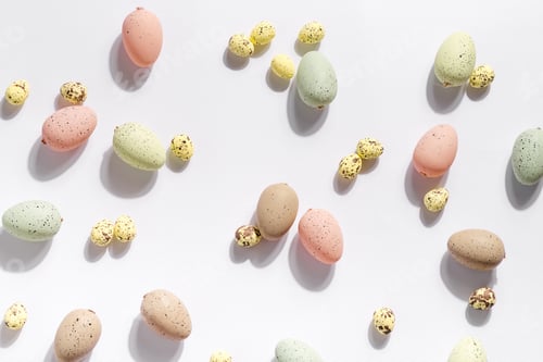 Preview: Happy Easter holiday background with colorful pastel eggs on white paper
