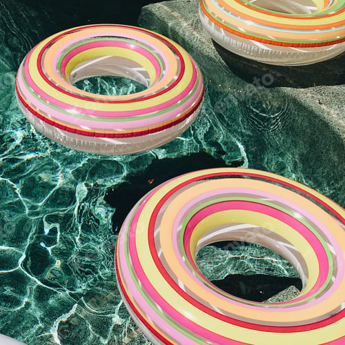Preview: Colorful pool floats in a pool of clear water