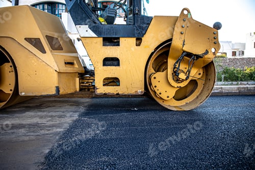 Preview: Close up on the road roller working on the new road construction site.