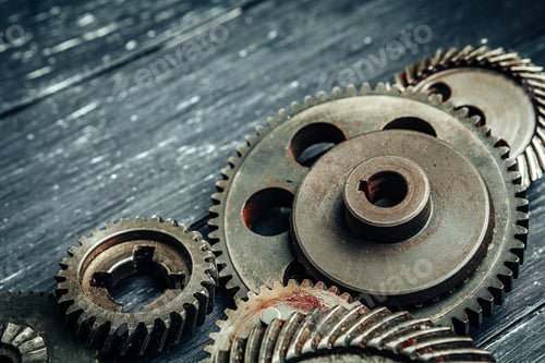 Preview: Car parts gears and bearings on wooden background