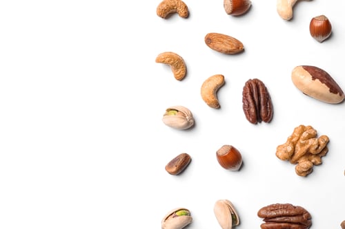 Preview: Composition with organic mixed nuts on white background, top view. Space for text