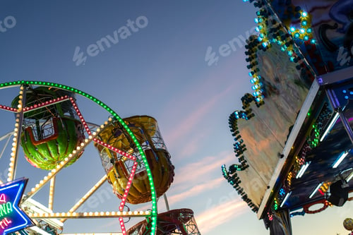Preview: Valencia, Spain - December 14, 2018: fairground with big ferris wheel at dusk.