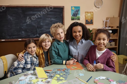 Preview: Smiling teacher with group of little kids