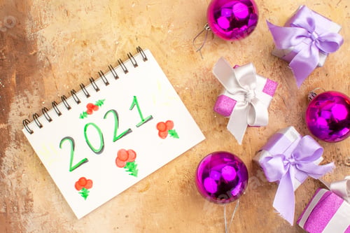 Preview: top view little purple presents with toys on light background gift holiday new year photo xmas