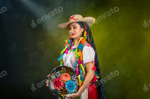 Preview: A woman wearing a sombrero and a colorful dress holding a plate with flowers