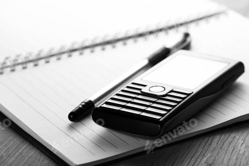 Preview: Phone and notebook on the desk