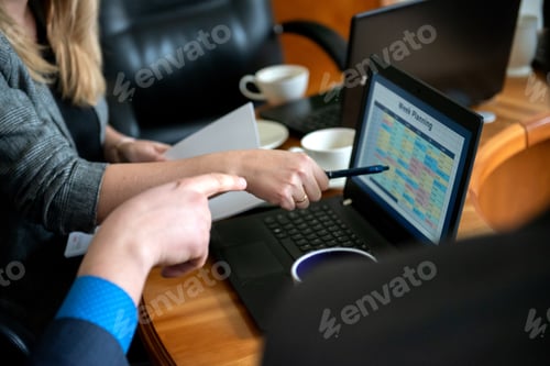 Preview: business people working with laptop, week planning