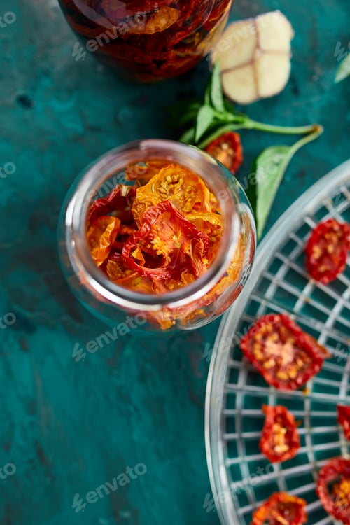 Preview: Homemade sun dried tomatoes with herbs, garlic in olive oil in a glass jar
