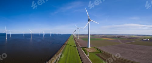 Preview: A stunning view of a row of wind turbines in Flevoland, Netherlands during Spring