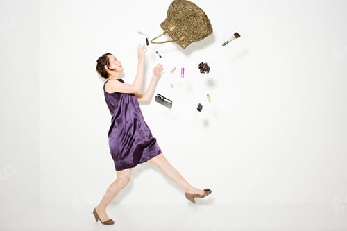 Preview: Woman playfully tossing her belongings in the air