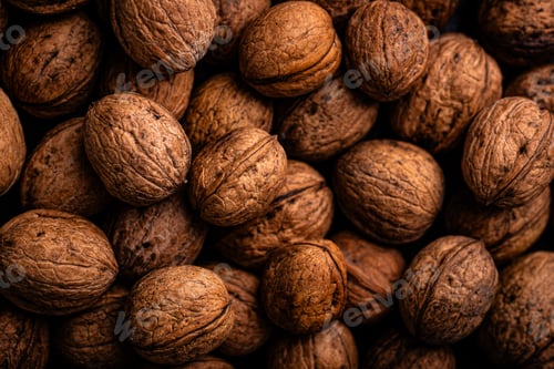 Preview: Textured pile of walnuts in closeup view