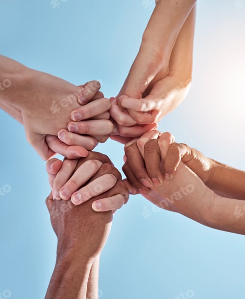 Preview: Were in this together. Shot of a group of unrecognizable people holding hands.