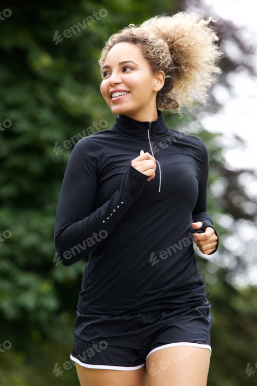 Preview: African american female runner in the park
