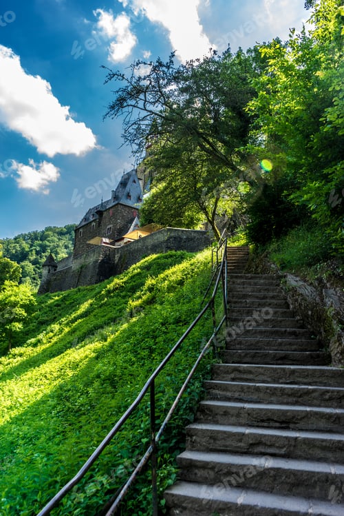Preview: Beautiful shot of the stairs leading to Eltz Castle surrounded by trees in Wierschem, Germany