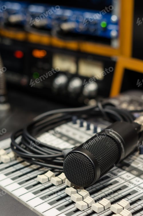 Preview: Close up of microphone with equipment on mixer in music studio, music instrument concept