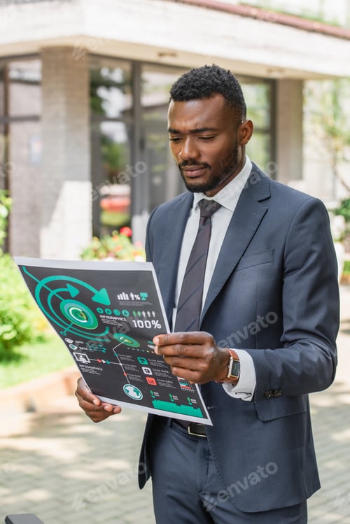 Preview: african american businessman holding printed infographics