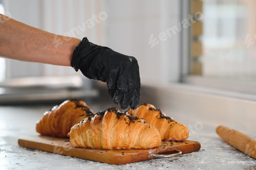 Preview: The baker decorates the finished croissants
