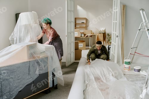 Preview: Young Caucasian Woman and Young Man Preparing Room during Home Renovation