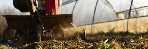 Preview: Farmer prepares the ground for the summer vegetable garden with a cutter