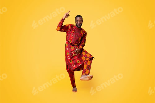 Preview: Cheery black guy having fun over yellow background