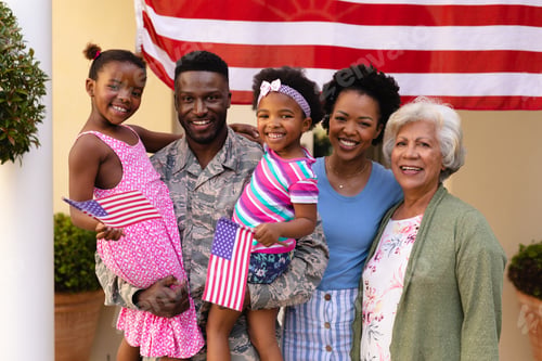 Preview: Portrait of smiling african american family with army father carrying daughters at entrance