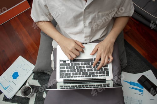 Preview: Working from Home with Laptop and Data Charts