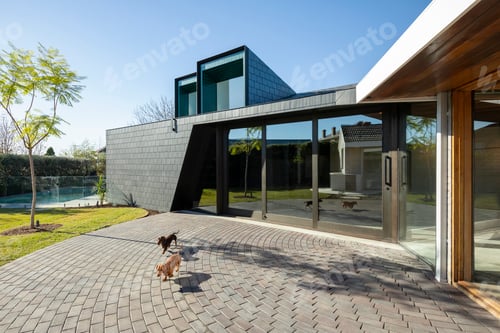 Modern Home Exterior With Paver Patio on Sunny Day