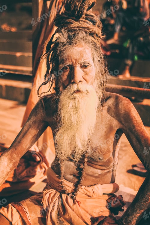 Preview: Sadhu man with traditional painted face and body in Varanasi, India